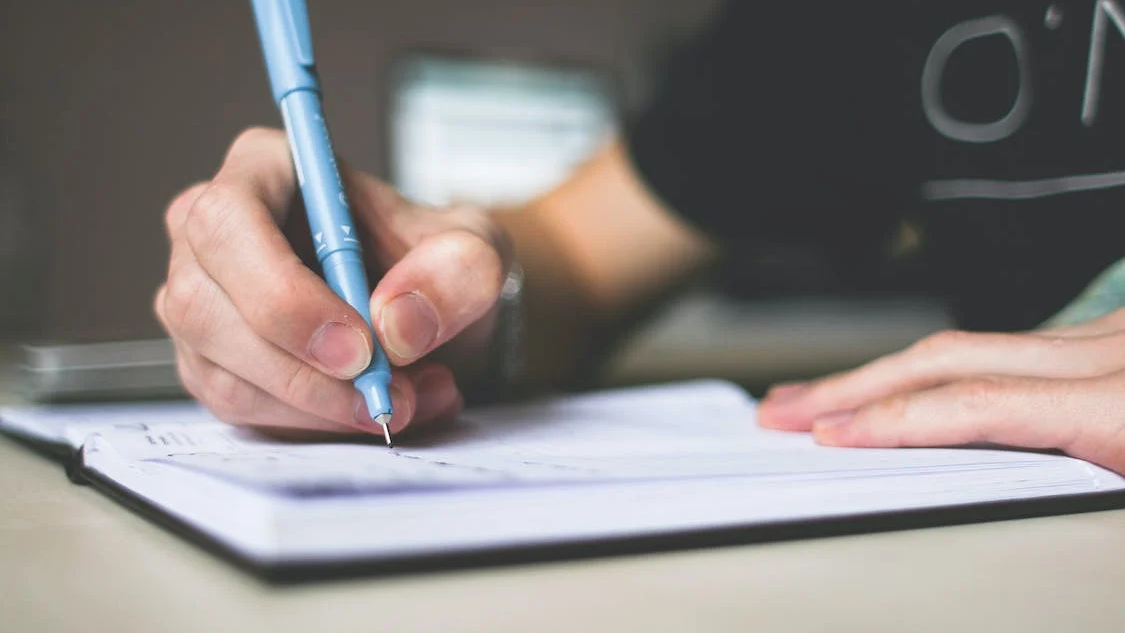 close up of someone writing an essay, bdsm punishment ideas